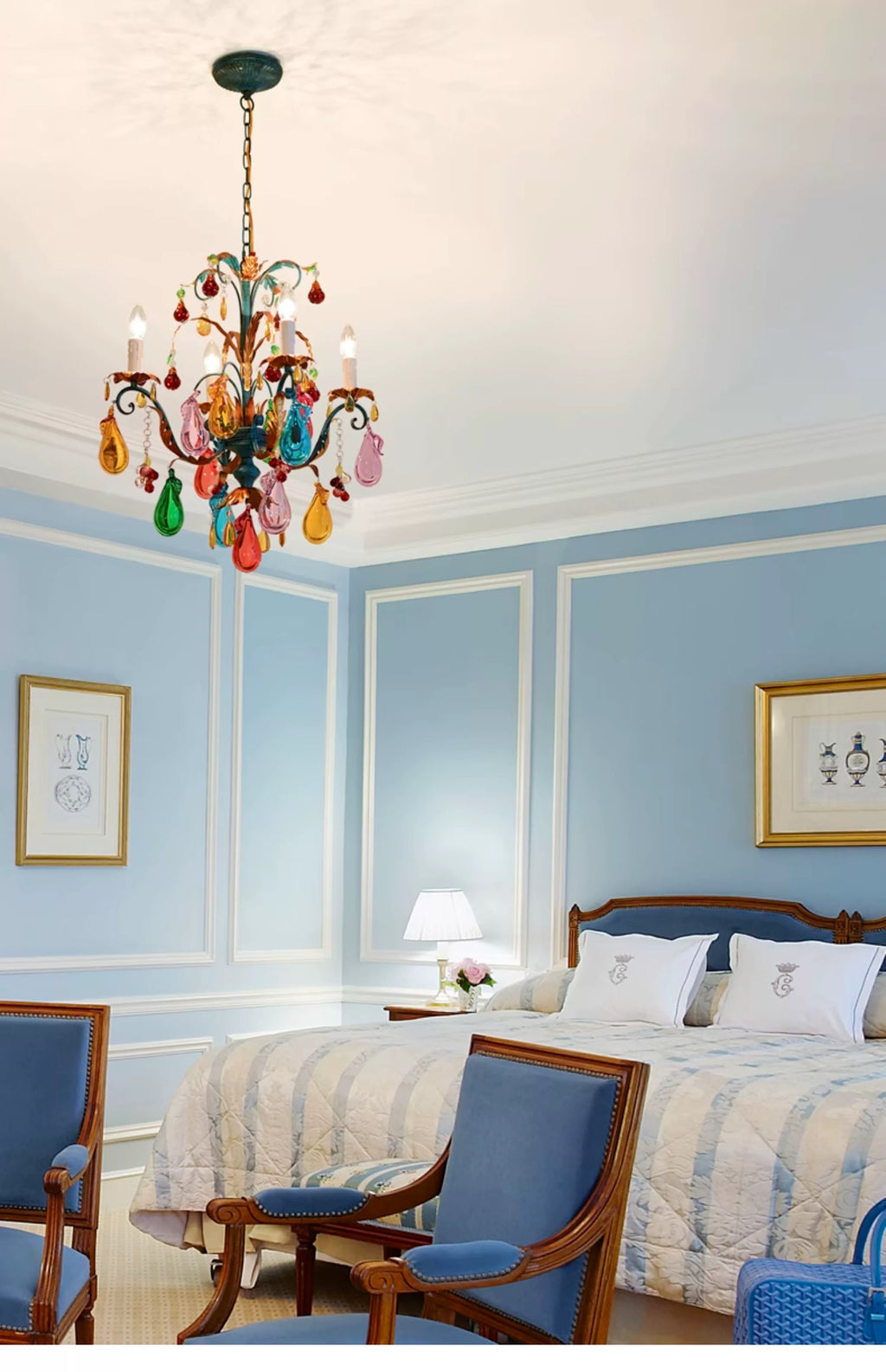 Four-light multicolour fruit chandelier in a blue bedroom.