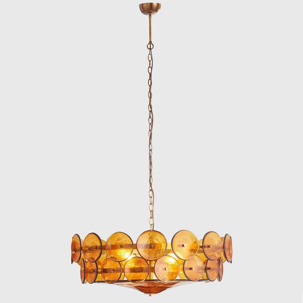 Amber two-tier disc-glass drum chandelier against a neutral background.