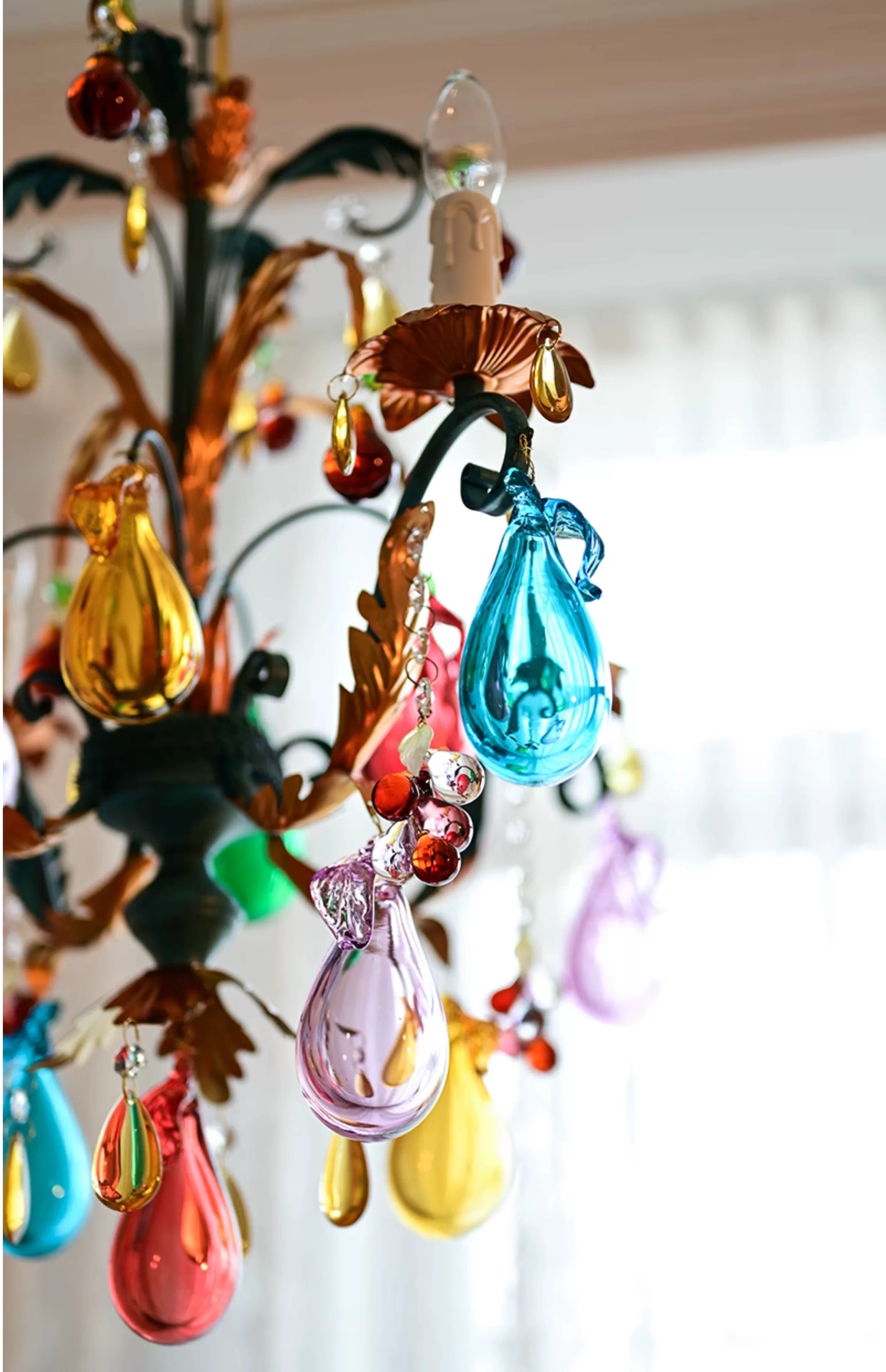 Close-up of the colourful glass fruit and teardrop ornaments.