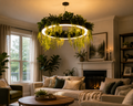 Botanical halo ring pendant light with cascading greenery above a warm modern living room.