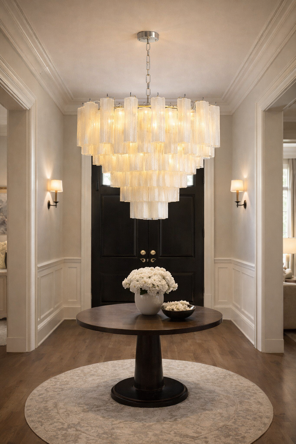 Ivory glass cascade chandelier installed in an elegant entrance.